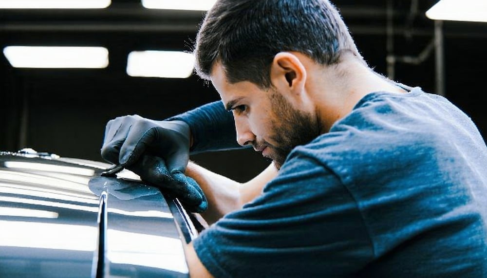 Auto detailing professional working on a car Auto detailing professional working on a car